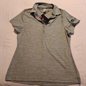 Under Armour women's medium, gray fitted top, has advertising on sleeve